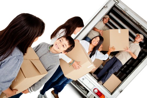 Removal team planning a house move in a residential Cheam street