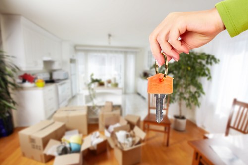 Careful loading of household items for transport in Cheam