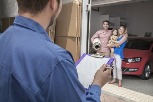 Unpacking boxes and arranging household items in a new Cheam property