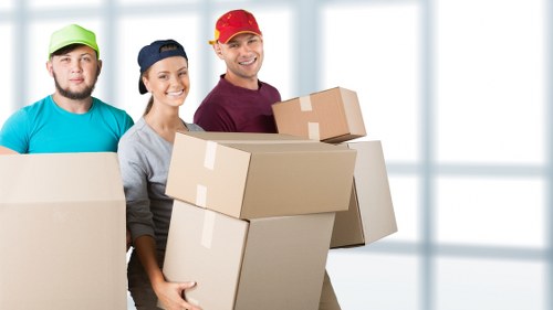 Packed boxes and furniture ready for a home relocation in Cheam