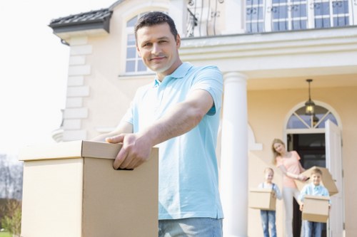 Careful loading of household items for removal services in Cheam