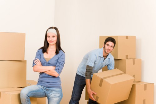 Professional movers handling furniture for a Cheam house move
