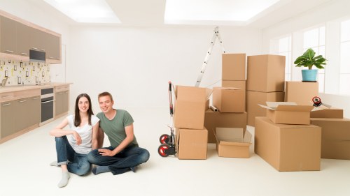 Loading furniture into a moving truck for a Cheam relocation