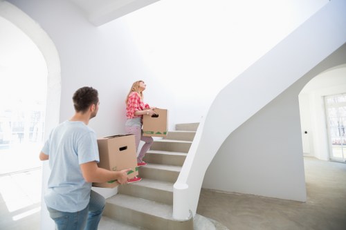 Moving day preparation with labelled boxes and packed household items